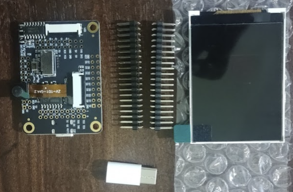 Maix Dock M1 kit (unassembled) with camera attached to mainboard and LCD display